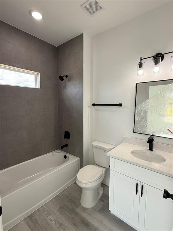 4875 Southwest 159th Lane Ocala, FL 34473 - Photo 17 of 32 a bathroom with a toilet sink a mirror and bathtub