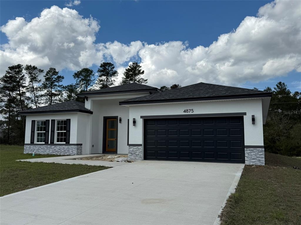 4875 Southwest 159th Lane Ocala, FL 34473 - Photo 28 of 32 front view of a house