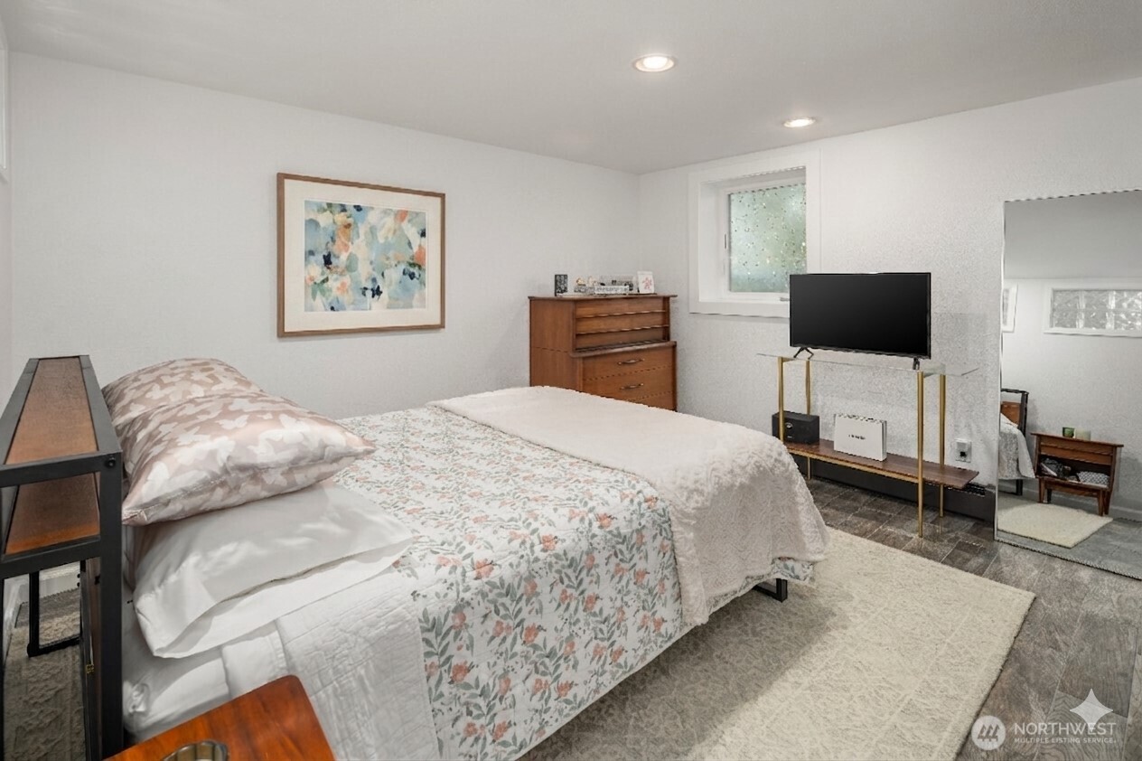 4014 Southwest 98th Street Seattle, WA 98136 - Photo 25 of 36 a bedroom with a bed and a flat screen tv