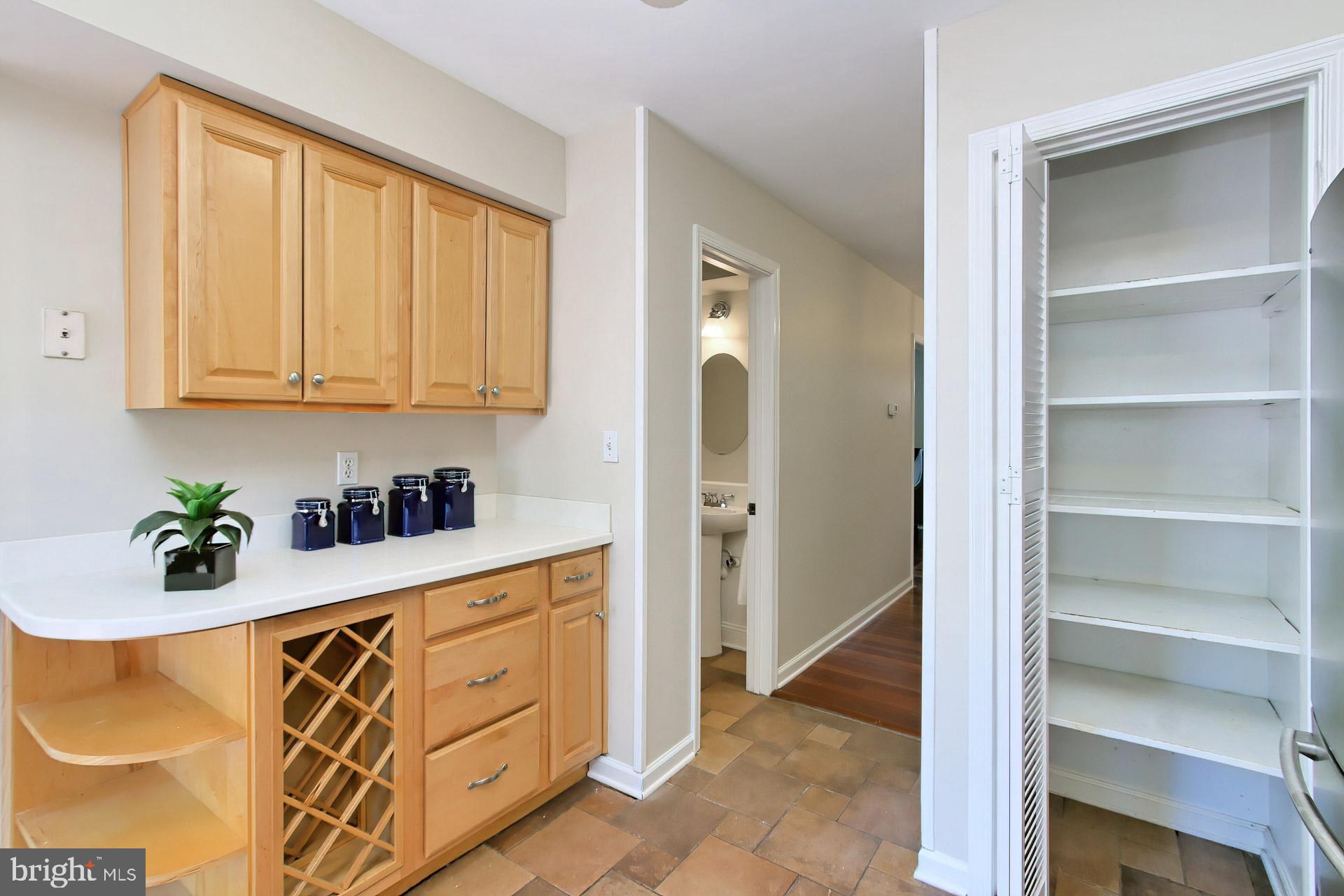 8324 Garfield Court Springfield, VA 22152 - Photo 14 of 59 Extra cabinets and wine rack plus a large pantry