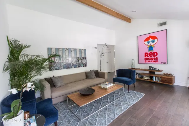 a living room with furniture and a couch