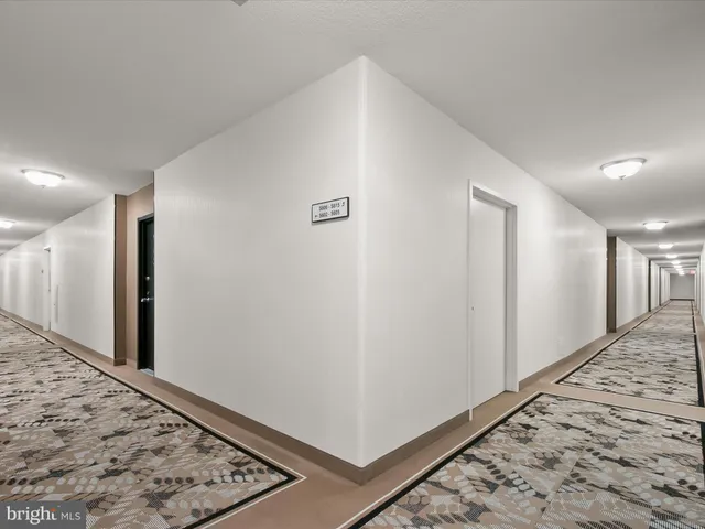 a kitchen with stainless steel appliances granite countertop a stove a microwave and a refrigerator