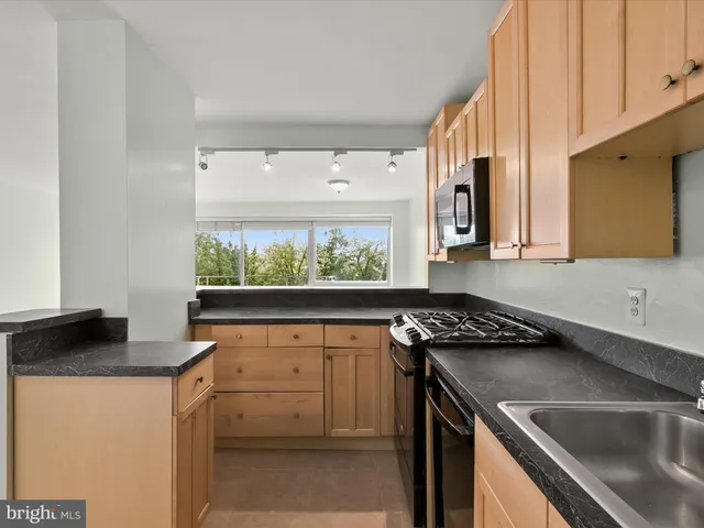 a view of a big room with a cabinet and a flat screen tv