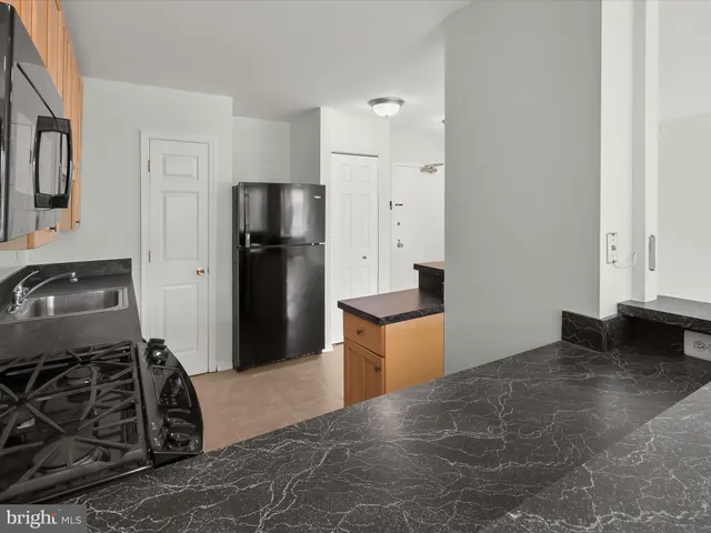 an empty room with closet and bathroom