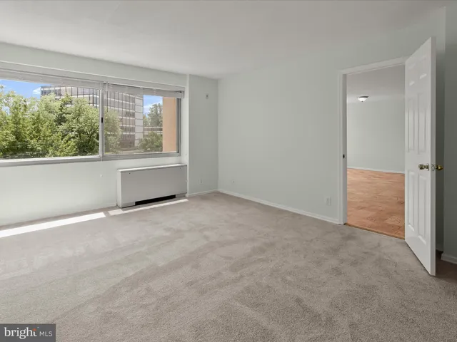 a room with gym equipment and a table