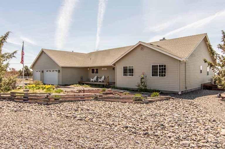 9587 Ridgeview Road Prineville, OR 97754 - Photo 1 of 25 Large covered deck; home sits on a bluff