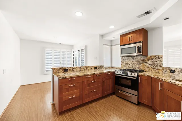 a view of an empty room with windows