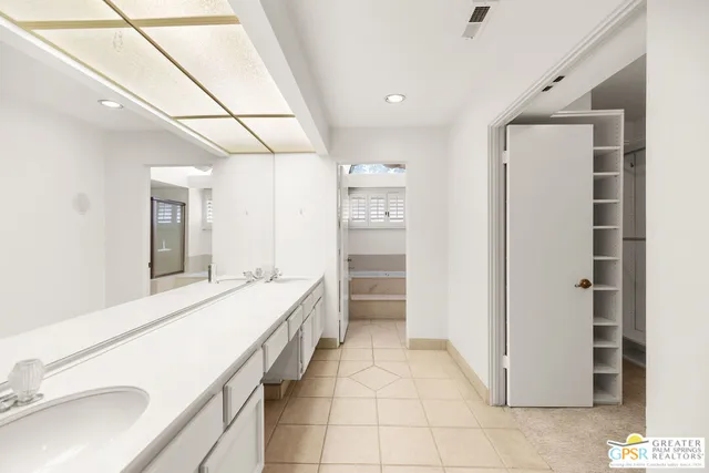 a bathroom with a toilet and a sink