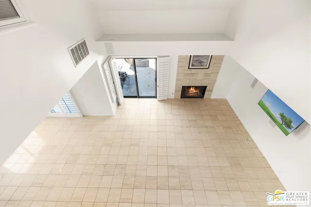a bathroom with a sink a toilet and a large mirror