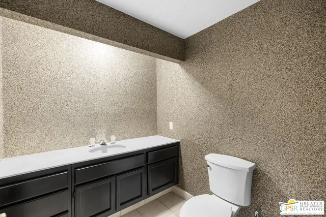 a view of an outdoor sitting area with golf table and chair