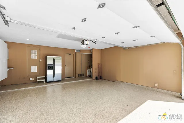 a view of the patio with a fire pit and potted plants