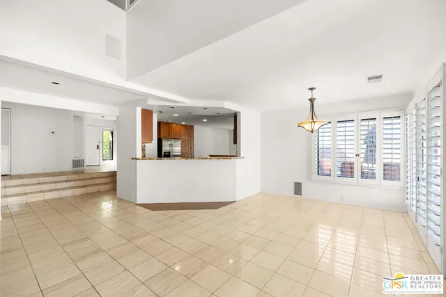 a view of living room with furniture and a fireplace