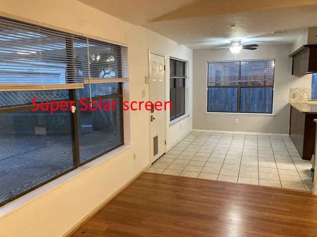 a view of a room with wooden floor