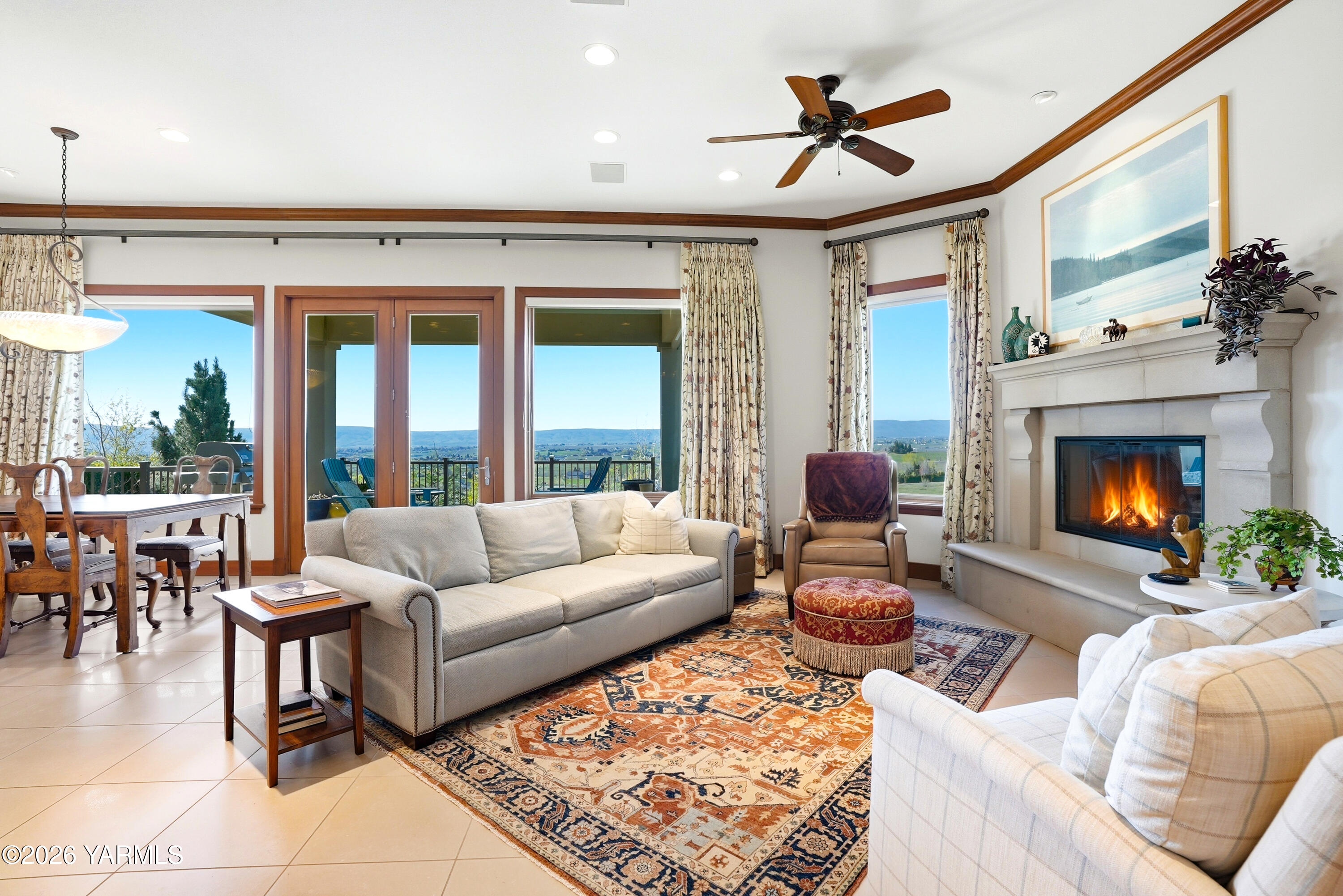 660 Noble Hill Road Yakima, WA 98908 - Photo 13 of 63 a living room with furniture a fireplace and floor to ceiling windows