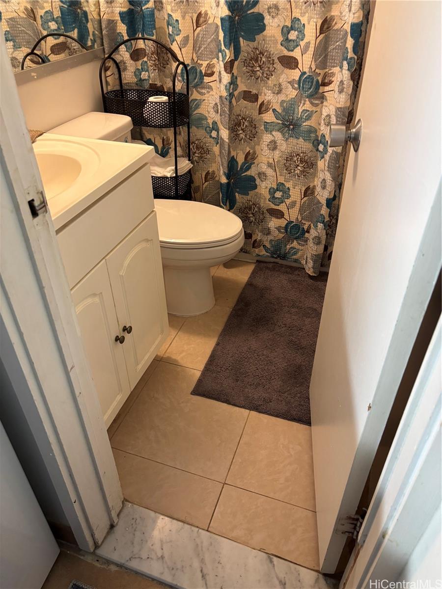 3215 Ala Ilima Street, Unit B404 Honolulu, HI 96818 - Photo 8 of 11 a bathroom with a toilet and a shower