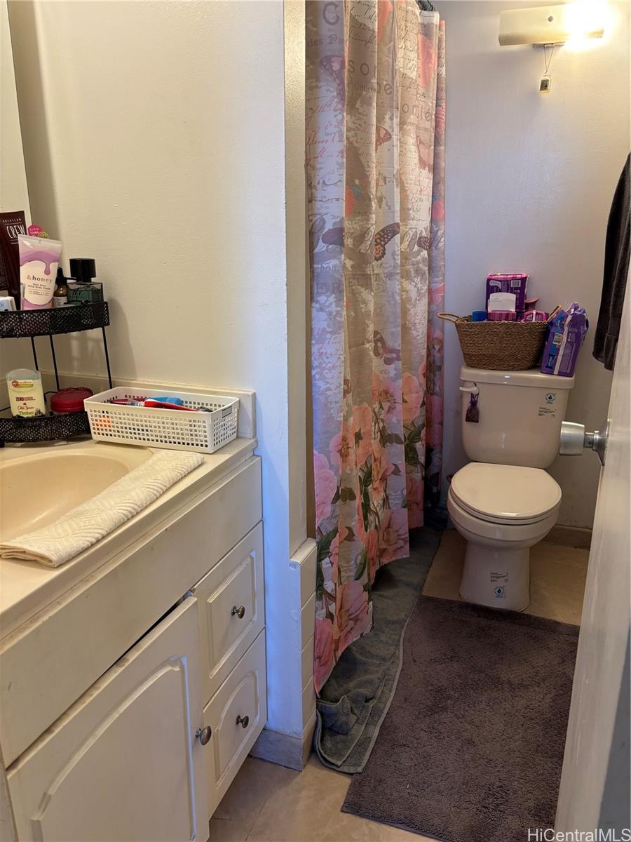 3215 Ala Ilima Street, Unit B404 Honolulu, HI 96818 - Photo 9 of 11 a bathroom with a sink toilet and shower