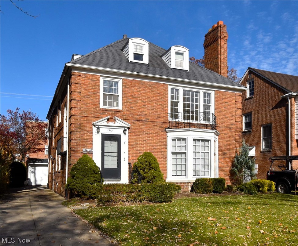 View of front of property with a front yard