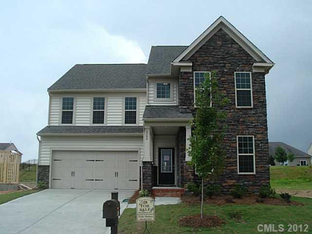 1500 Ridgehaven Road, Unit 147 Waxhaw, NC 28173 - Photo 1 of 14 a view of a house with a yard