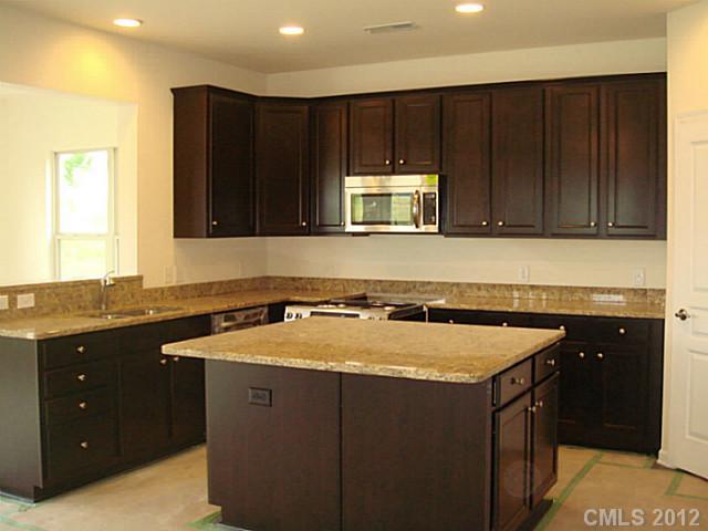 1500 Ridgehaven Road, Unit 147 Waxhaw, NC 28173 - Photo 2 of 14 a kitchen with a sink and a cabinets