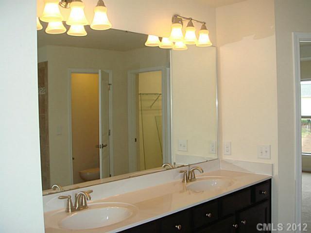 1500 Ridgehaven Road, Unit 147 Waxhaw, NC 28173 - Photo 8 of 14 a bathroom with a sink and a mirror