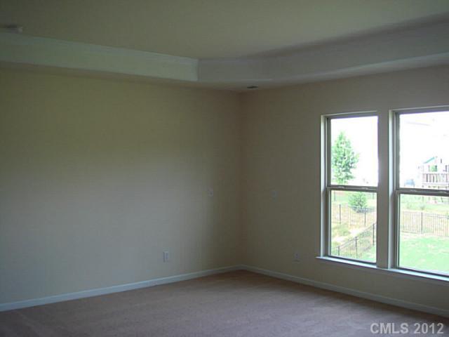1500 Ridgehaven Road, Unit 147 Waxhaw, NC 28173 - Photo 9 of 14 an empty room with a window