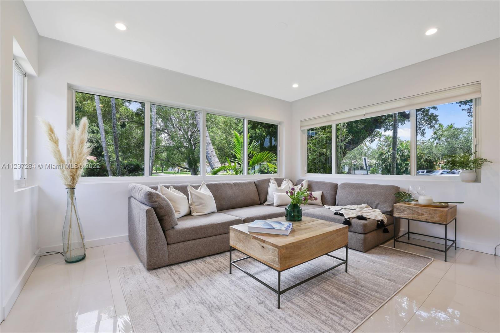440 Blue Road Coral Gables, FL 33146 - Photo 11 of 20 a living room with furniture and a large window