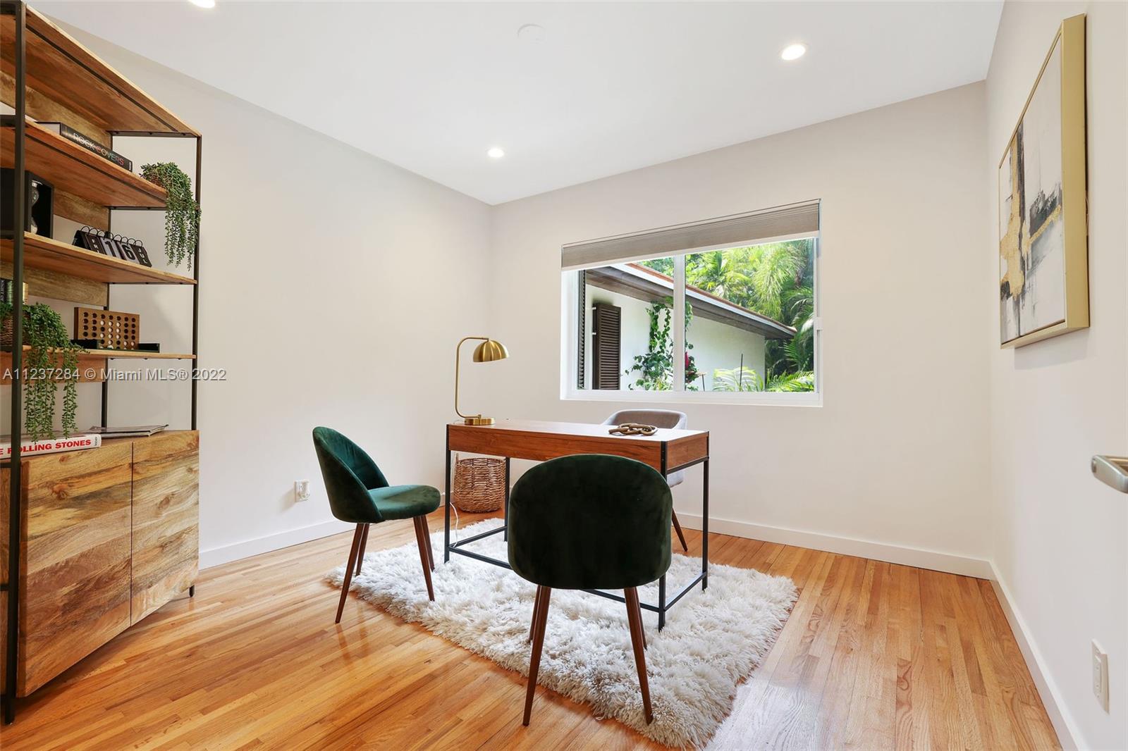 440 Blue Road Coral Gables, FL 33146 - Photo 12 of 20 a view of a workspace with furniture and a window
