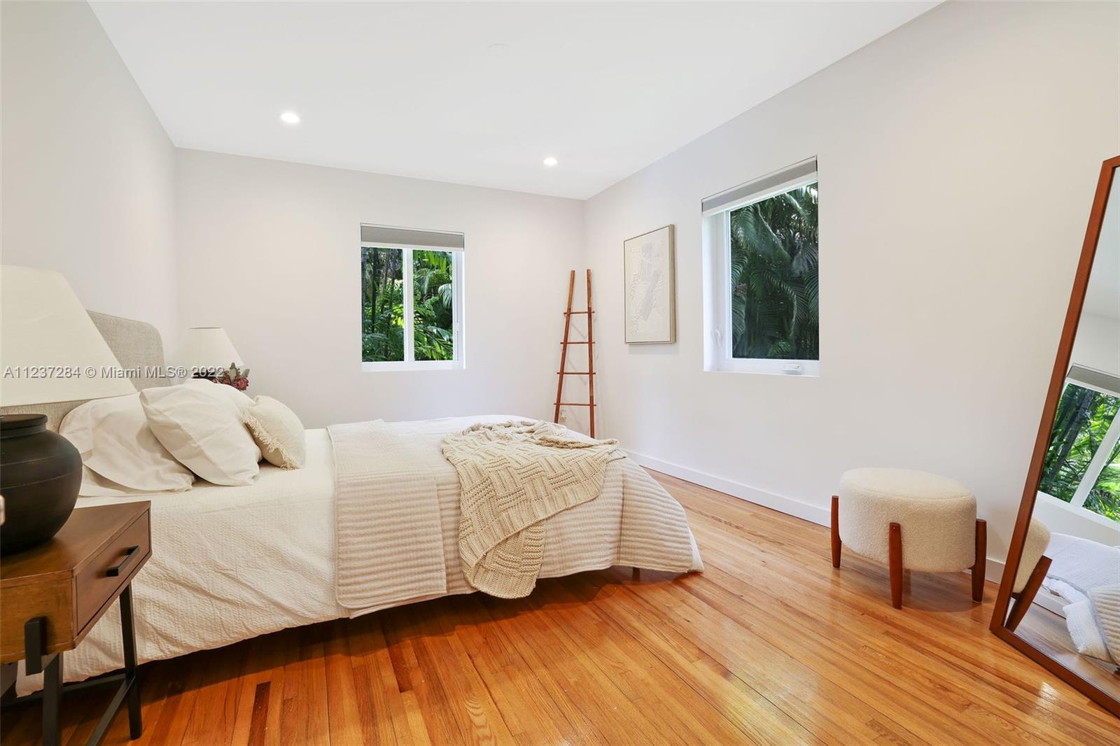 440 Blue Road Coral Gables, FL 33146 - Photo 13 of 20 a bedroom with a bed and a window