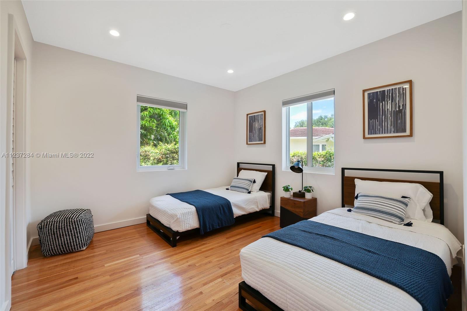 440 Blue Road Coral Gables, FL 33146 - Photo 14 of 20 a bedroom with two beds and a window