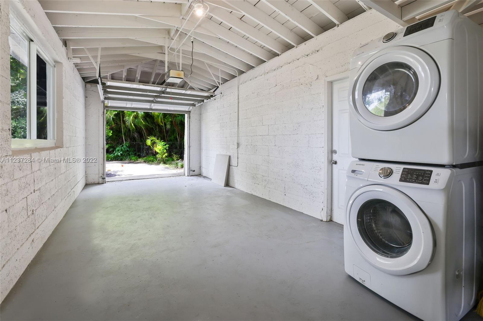 440 Blue Road Coral Gables, FL 33146 - Photo 19 of 20 a view of a hallway with washer and dryer