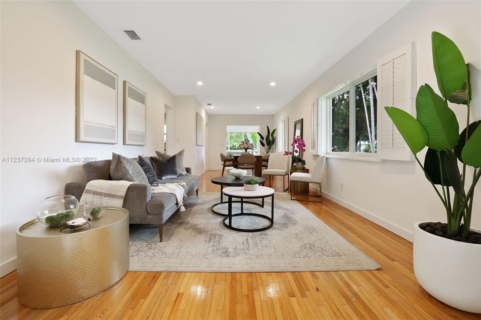 440 Blue Road Coral Gables, FL 33146 - Photo 4 of 20 a living room with furniture and a potted plant