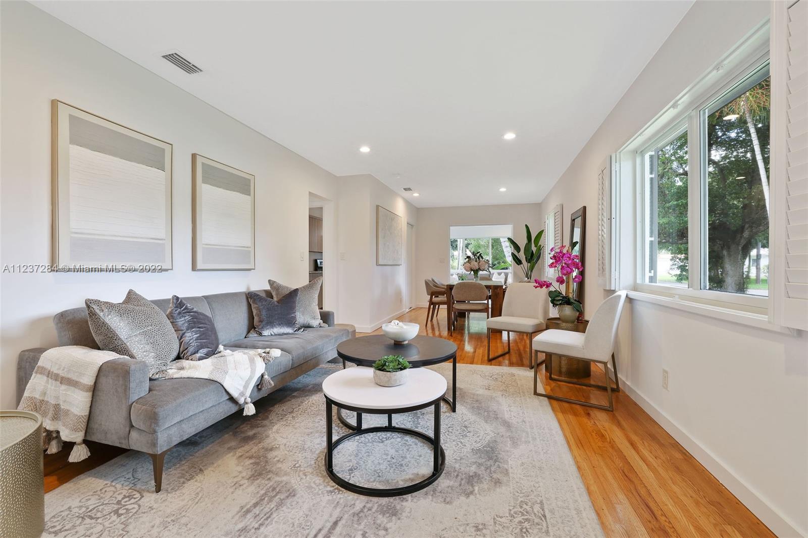 440 Blue Road Coral Gables, FL 33146 - Photo 5 of 20 a living room with furniture and a large window