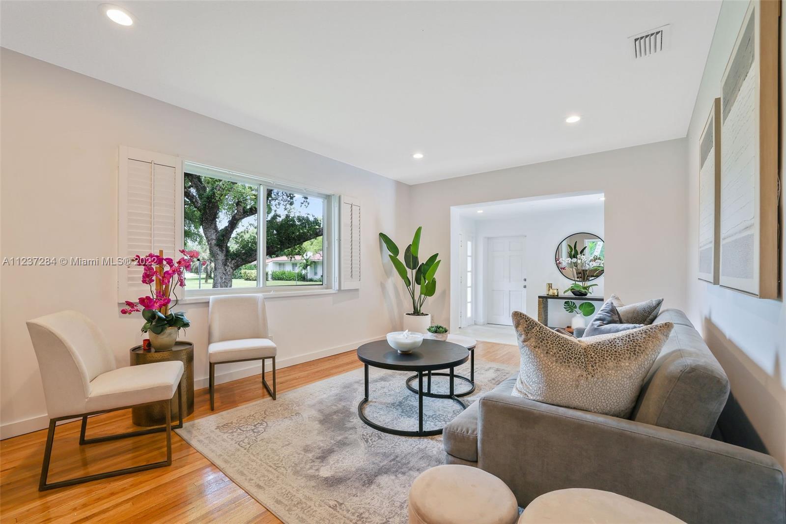 440 Blue Road Coral Gables, FL 33146 - Photo 6 of 20 a living room with furniture and a potted plant