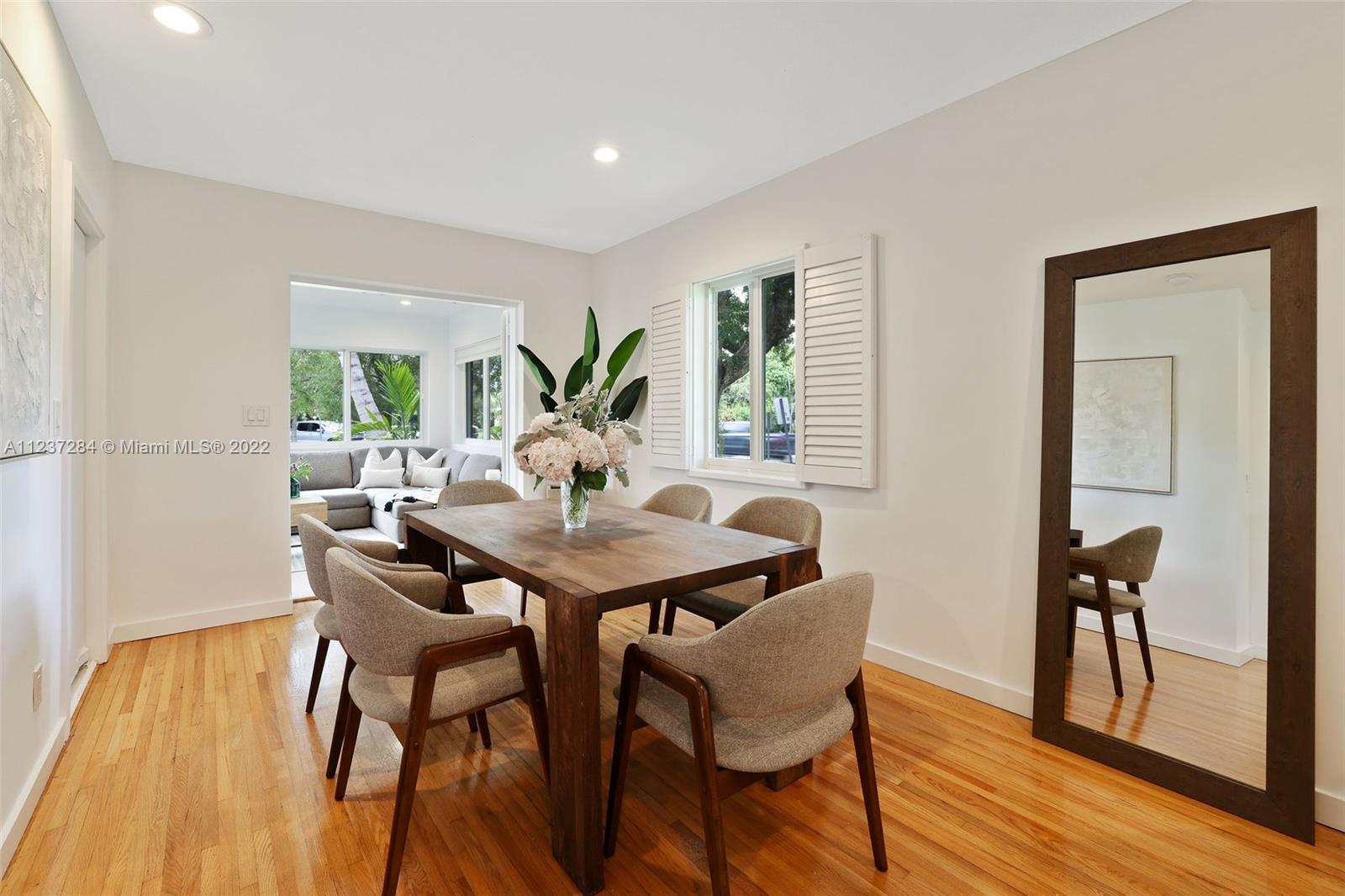 440 Blue Road Coral Gables, FL 33146 - Photo 7 of 20 a view of a dining room with furniture and wooden floor
