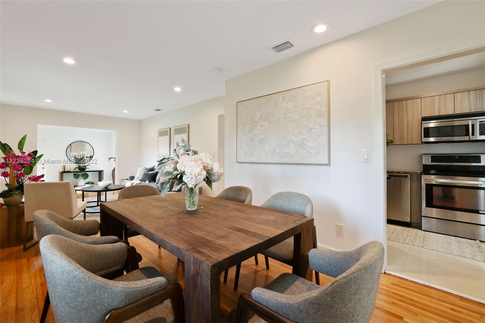440 Blue Road Coral Gables, FL 33146 - Photo 8 of 20 a view of a dining room with furniture