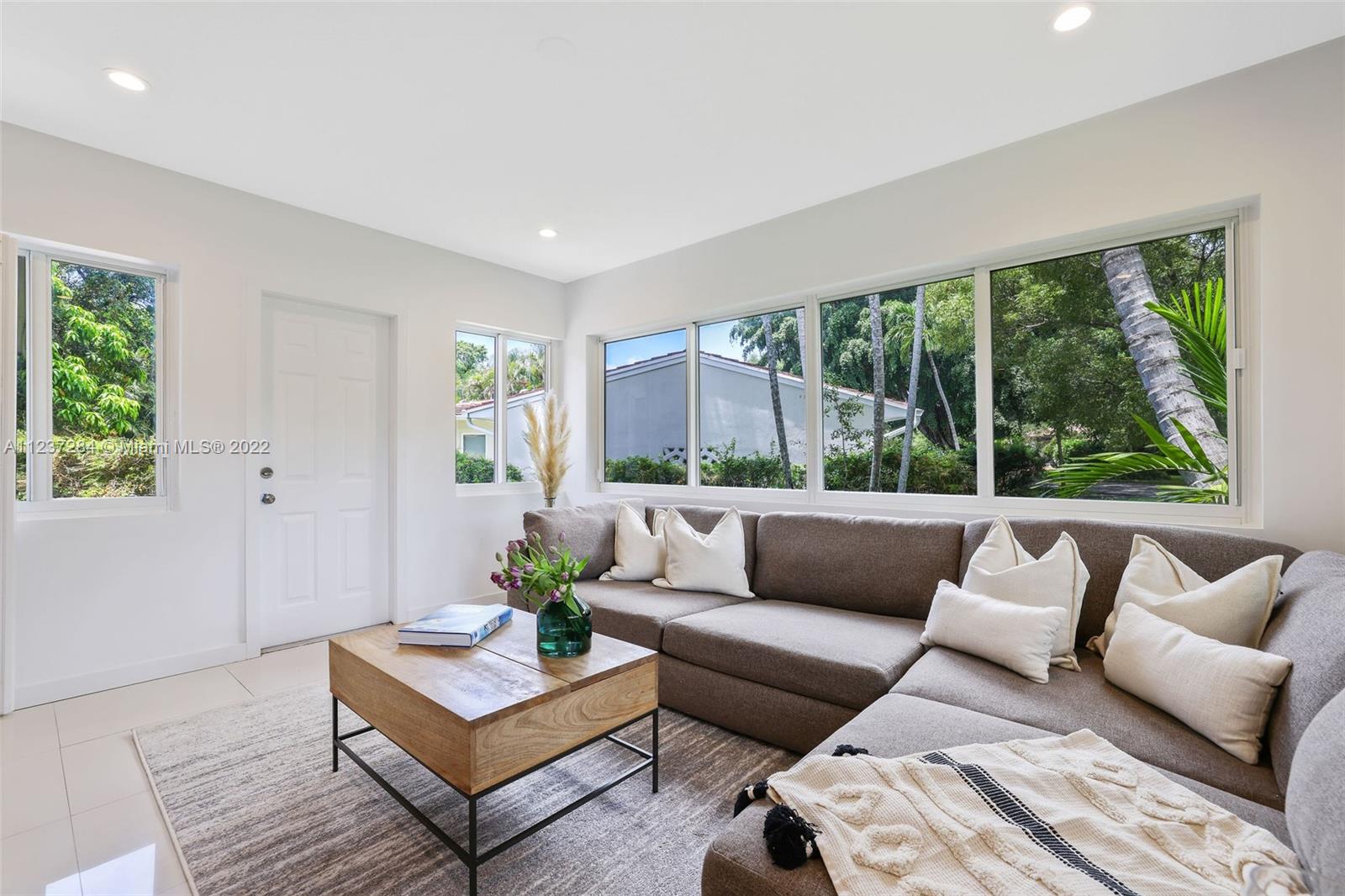440 Blue Road Coral Gables, FL 33146 - Photo 10 of 20 a living room with furniture and a large window