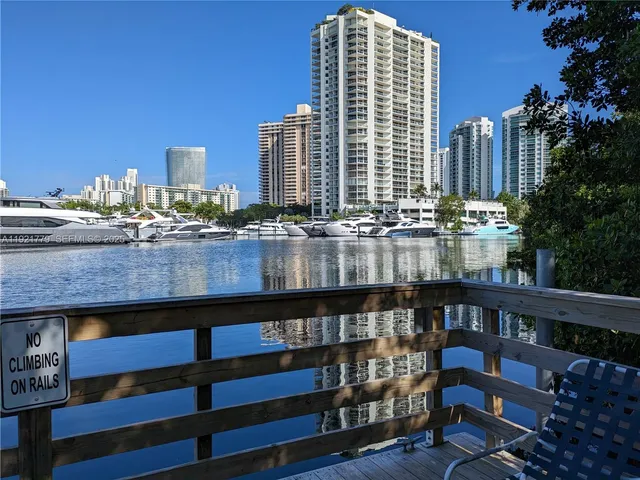 a view of a balcony with outdoor seating