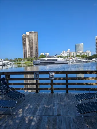 a view of a terrace with wooden floor and city view