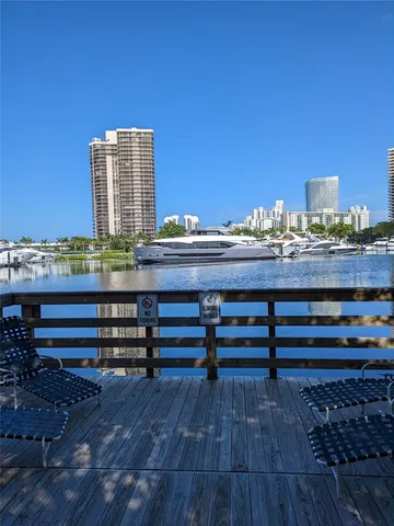 a view of a terrace with wooden floor and city view