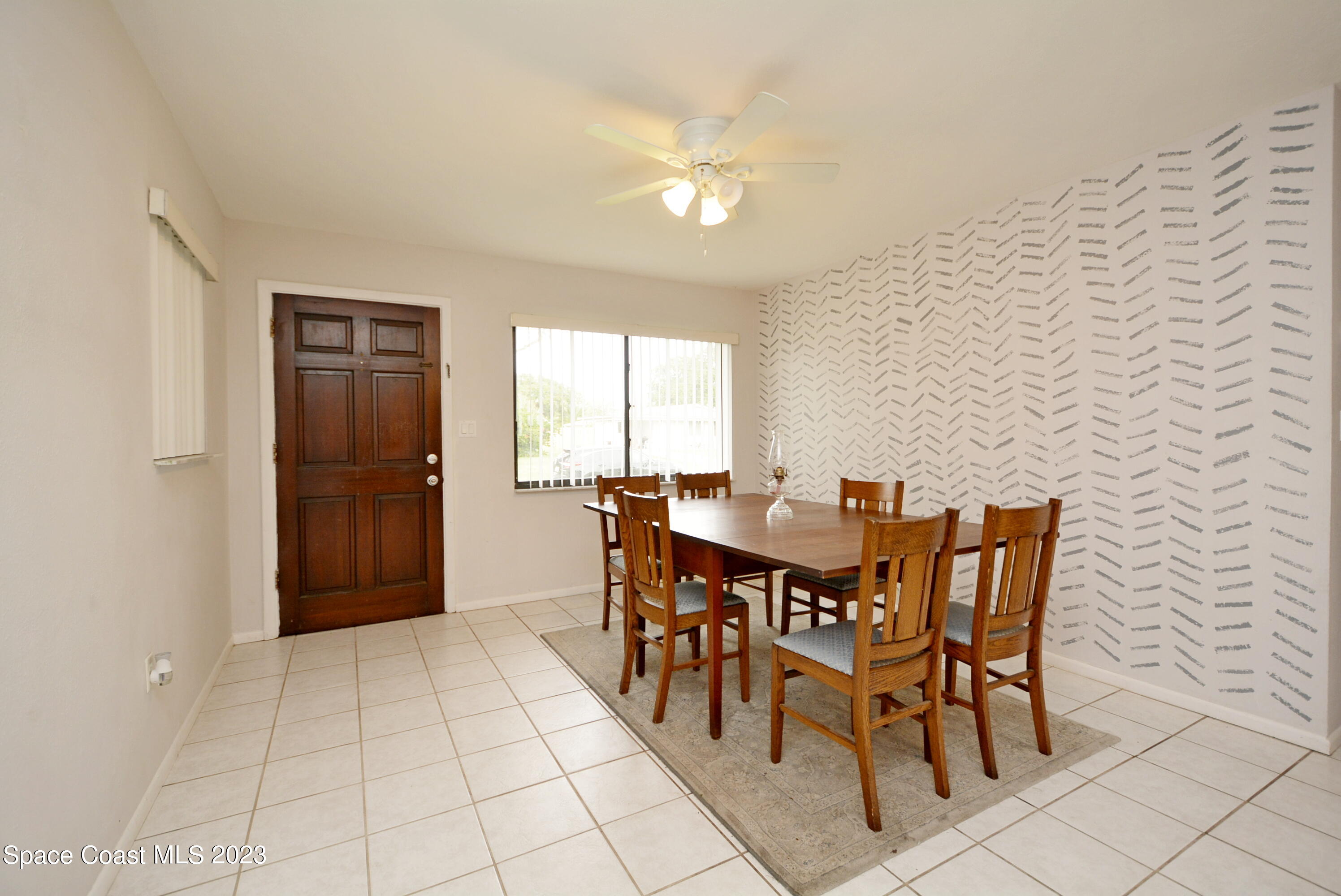 2579 Coventry Road Melbourne, FL 32935 - Photo 21 of 36 a view of a dining room with furniture