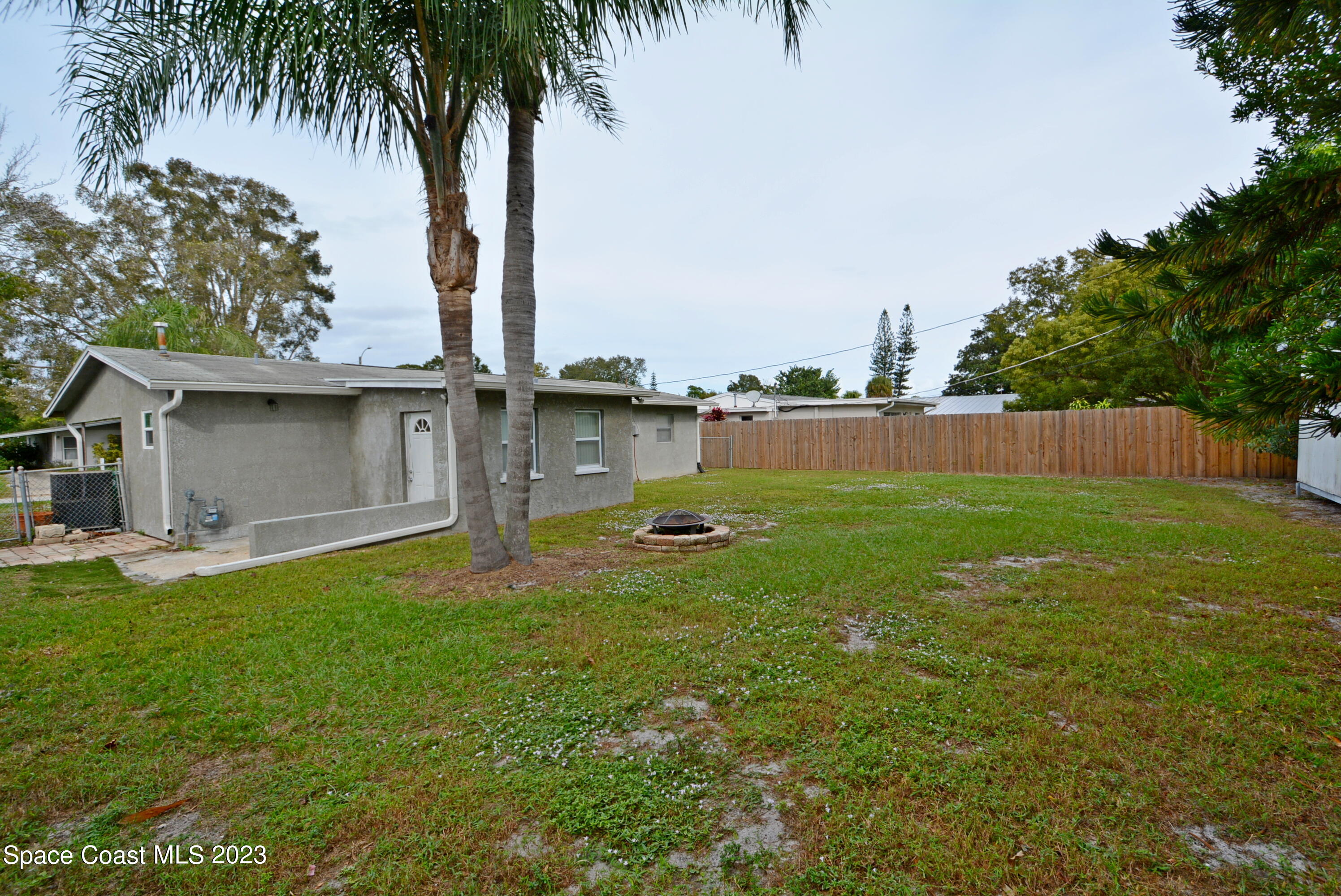 2579 Coventry Road Melbourne, FL 32935 - Photo 27 of 36 a view of a backyard with a garden and plants