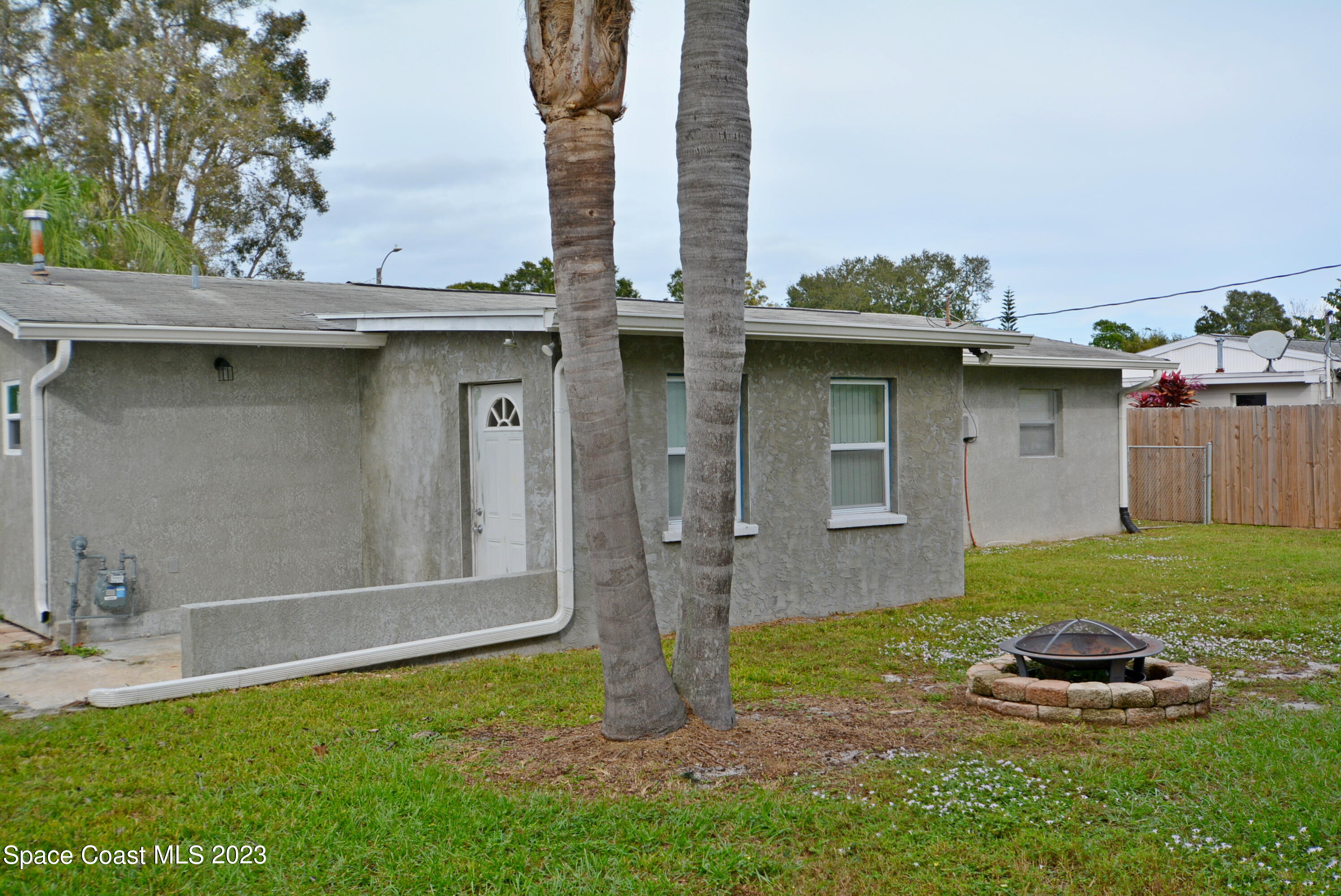 2579 Coventry Road Melbourne, FL 32935 - Photo 28 of 36 a front view of a house with garden