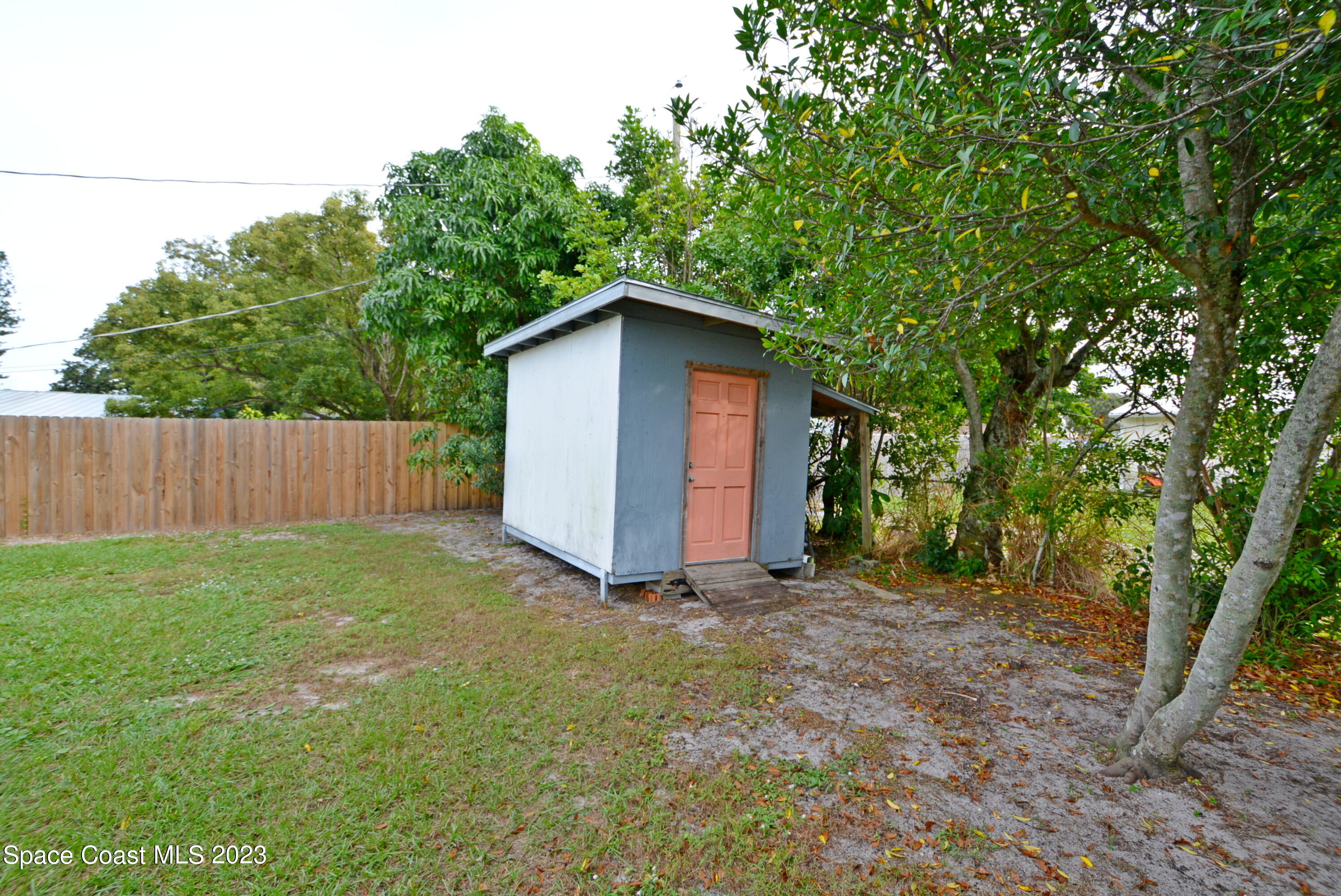 2579 Coventry Road Melbourne, FL 32935 - Photo 29 of 36 a view of backyard with green space