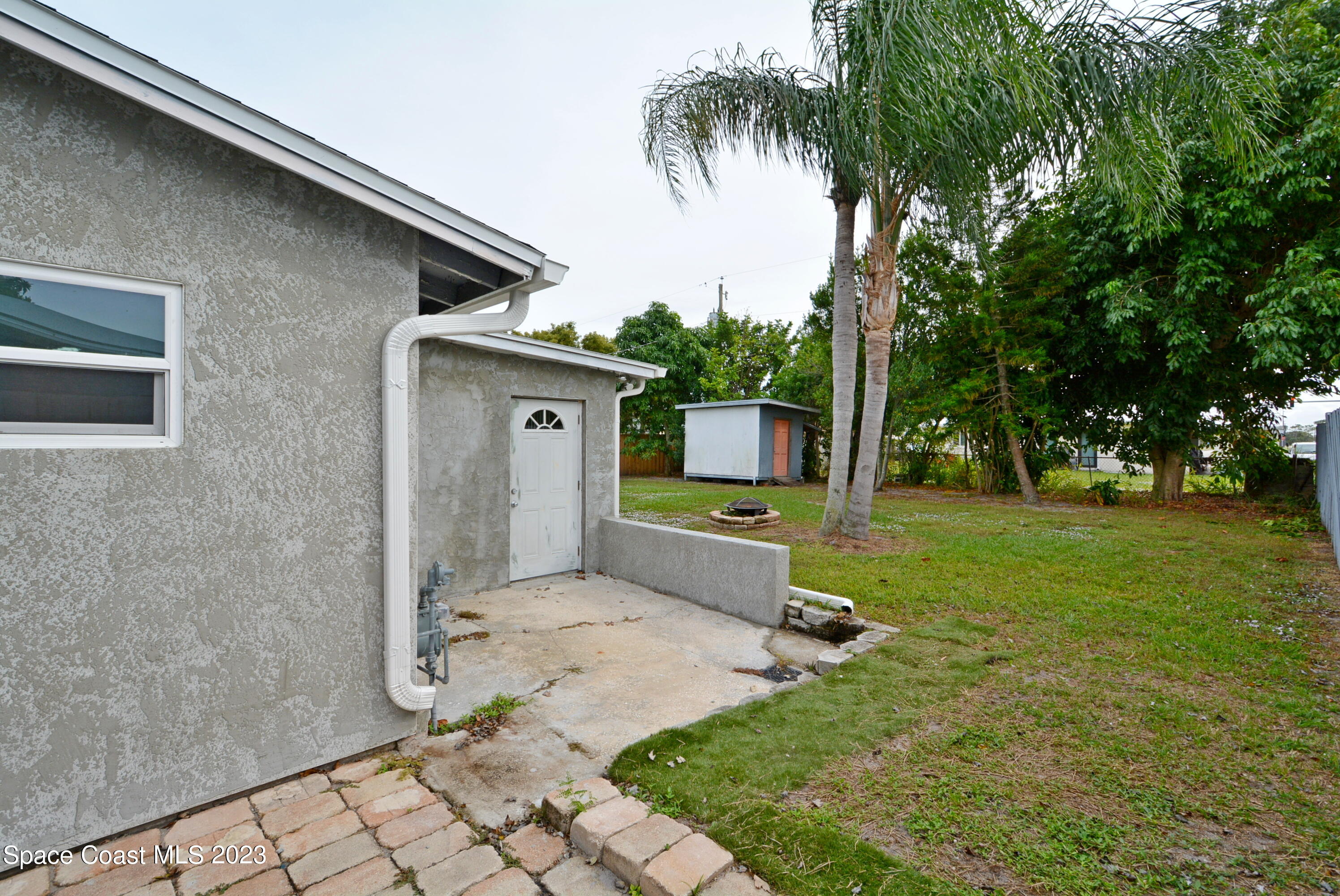2579 Coventry Road Melbourne, FL 32935 - Photo 36 of 36 a house view with a garden space