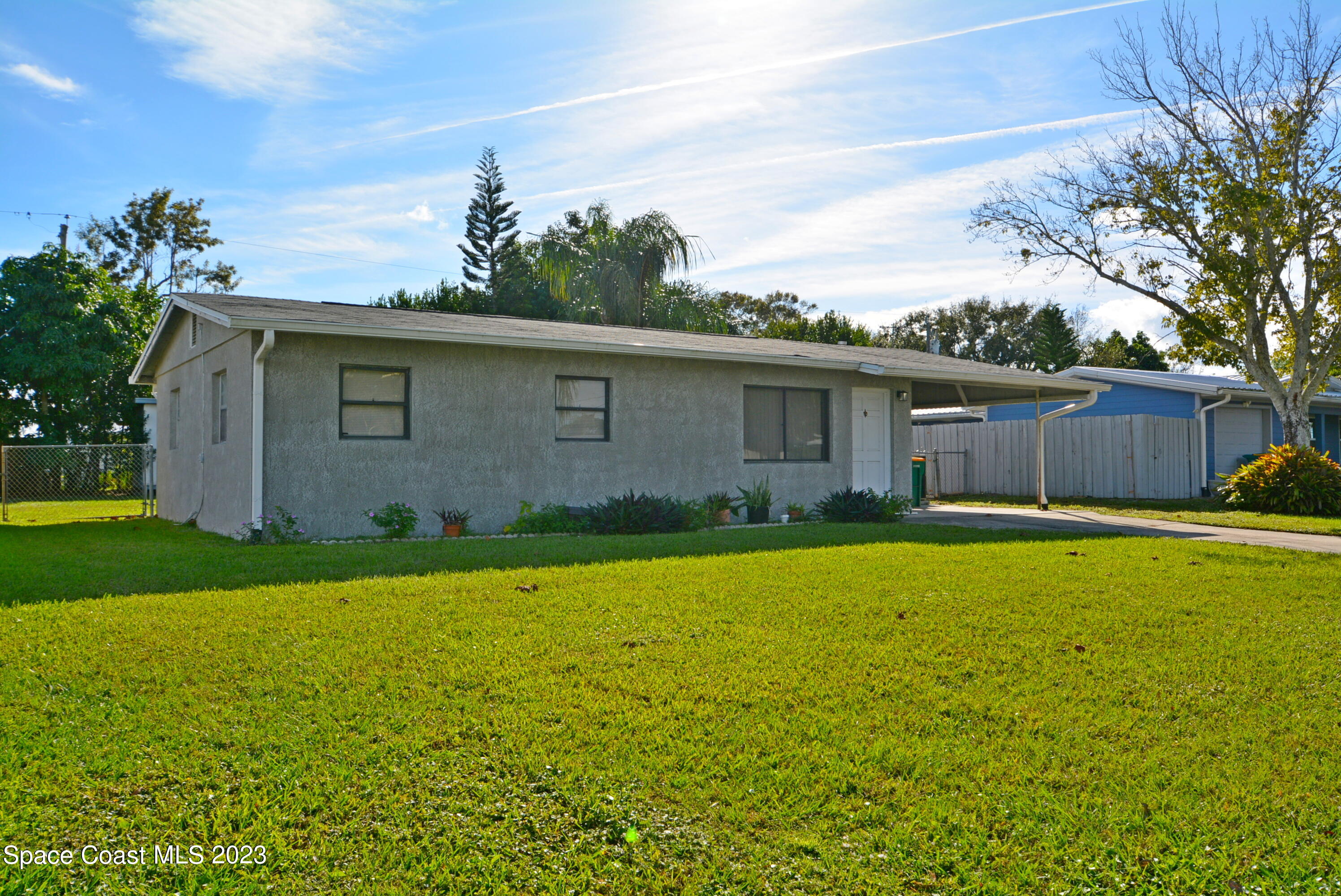 2579 Coventry Road Melbourne, FL 32935 - Photo 4 of 36 a view of a house with a yard