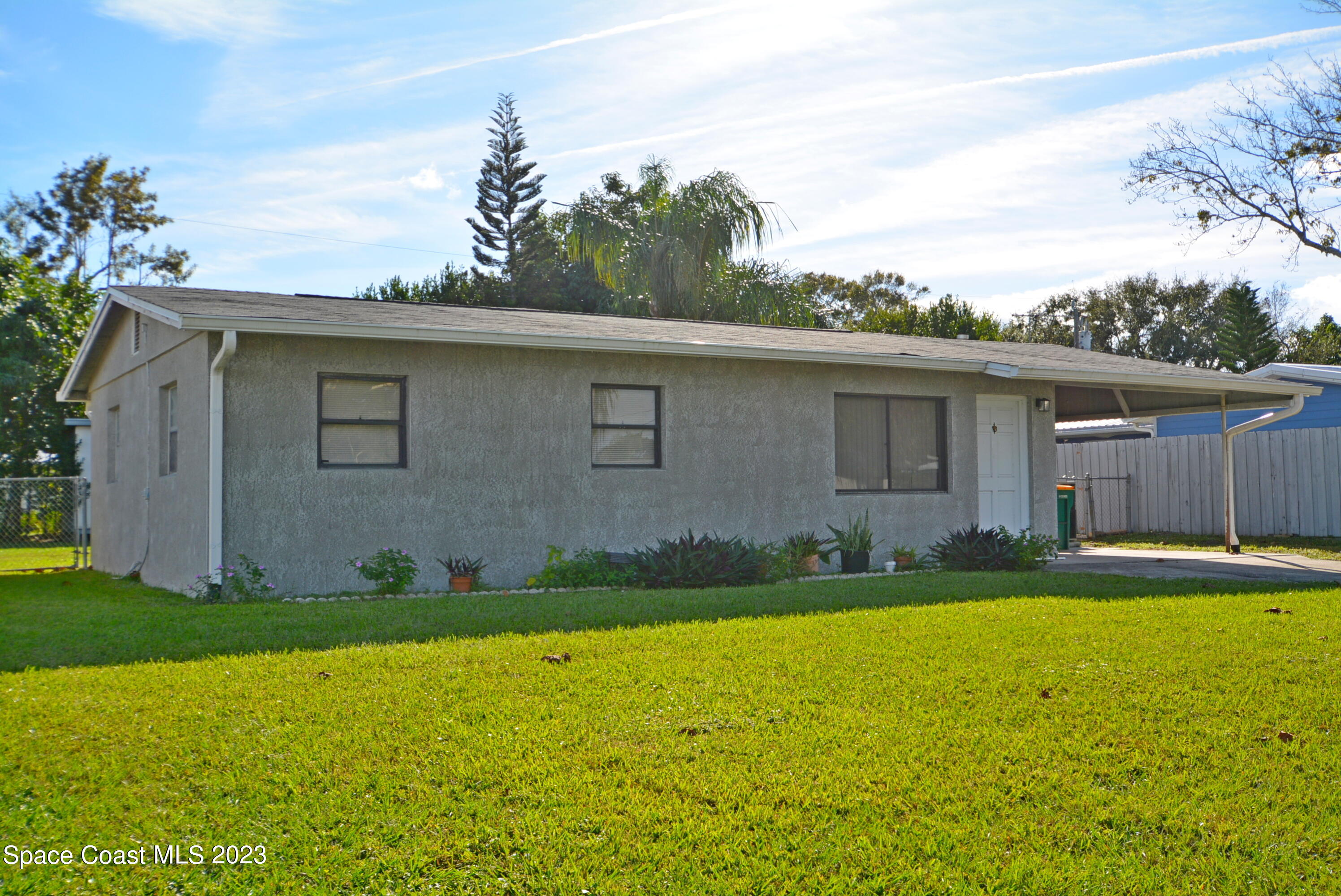 2579 Coventry Road Melbourne, FL 32935 - Photo 5 of 36 a view of a house with a yard