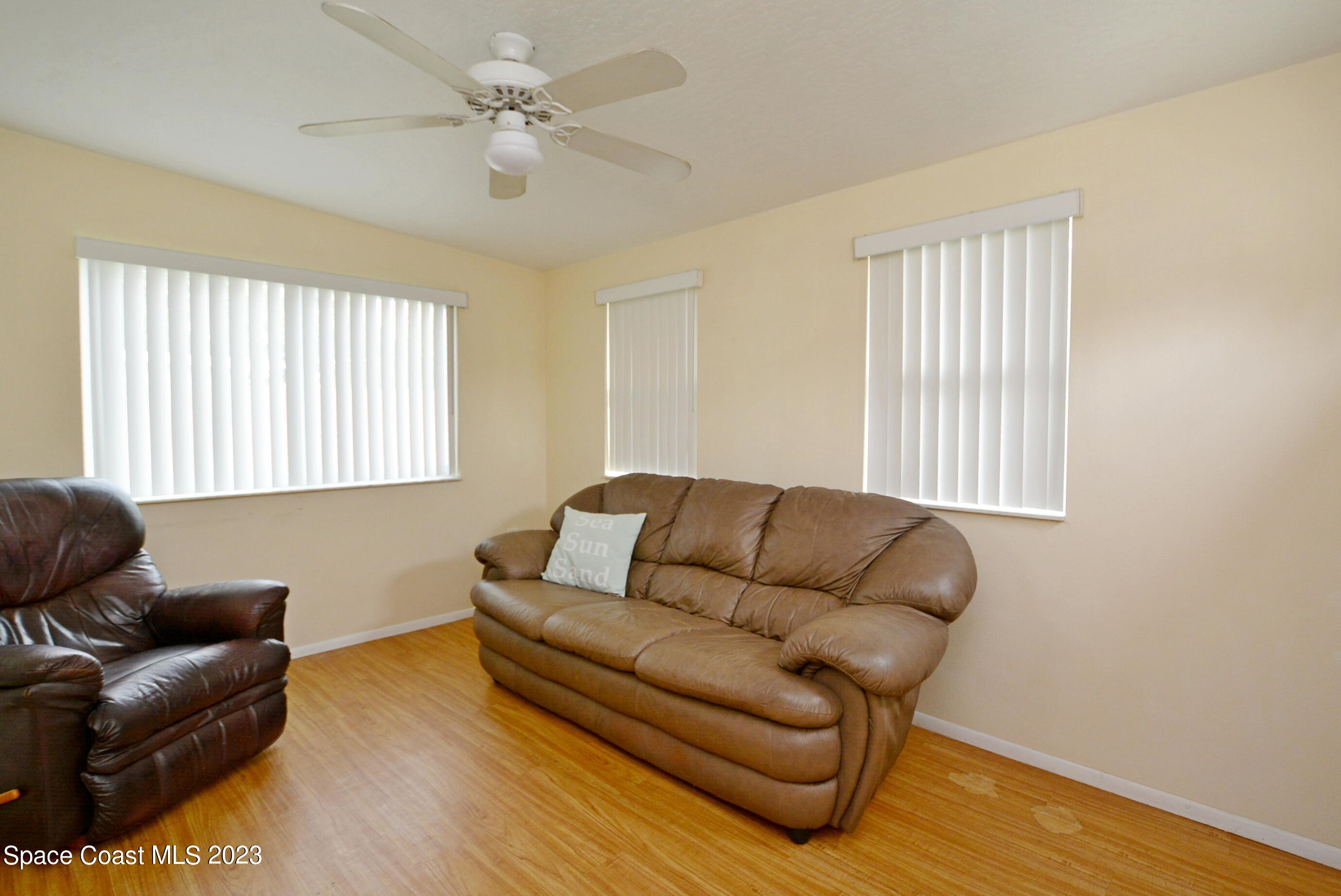 2579 Coventry Road Melbourne, FL 32935 - Photo 6 of 36 a living room with furniture and a window