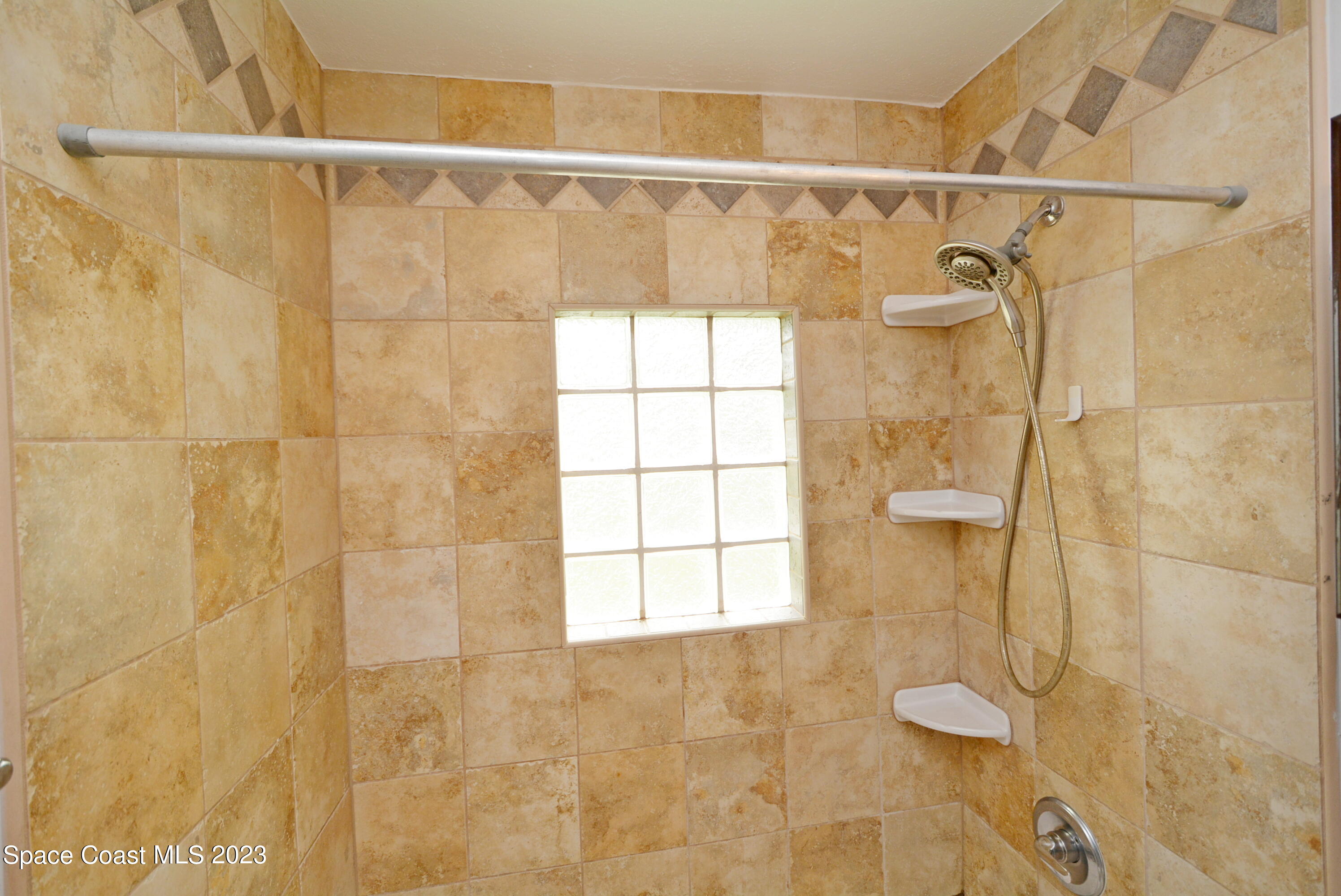 2579 Coventry Road Melbourne, FL 32935 - Photo 10 of 36 a bathroom with a shower