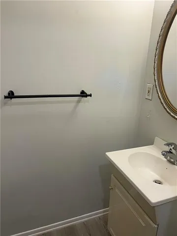 a bathroom with a sink and mirror