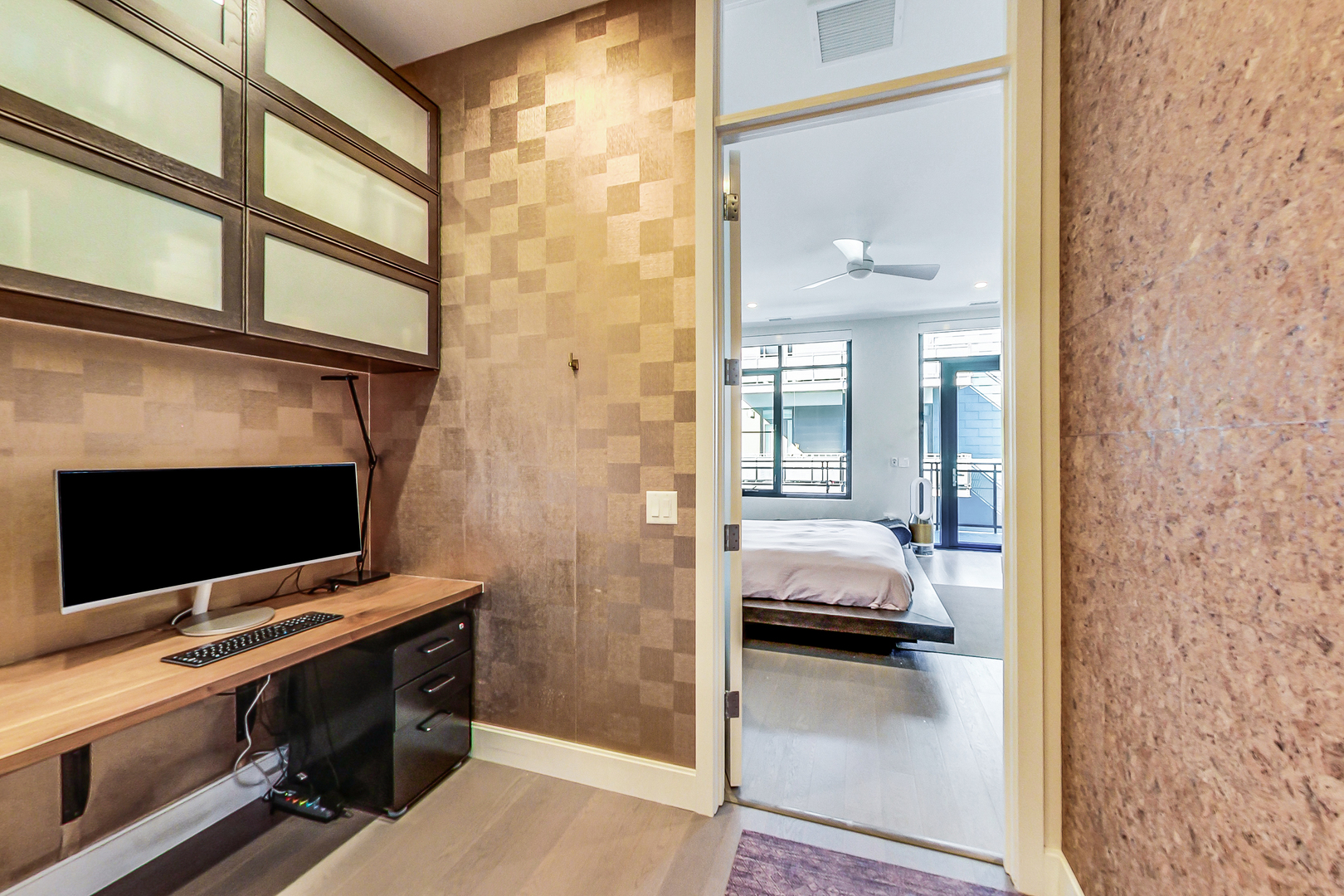 40 North Carpenter Street, Unit 5N Chicago, IL 60607 - Photo 25 of 29 a en suite bathroom with a sink and a mirror